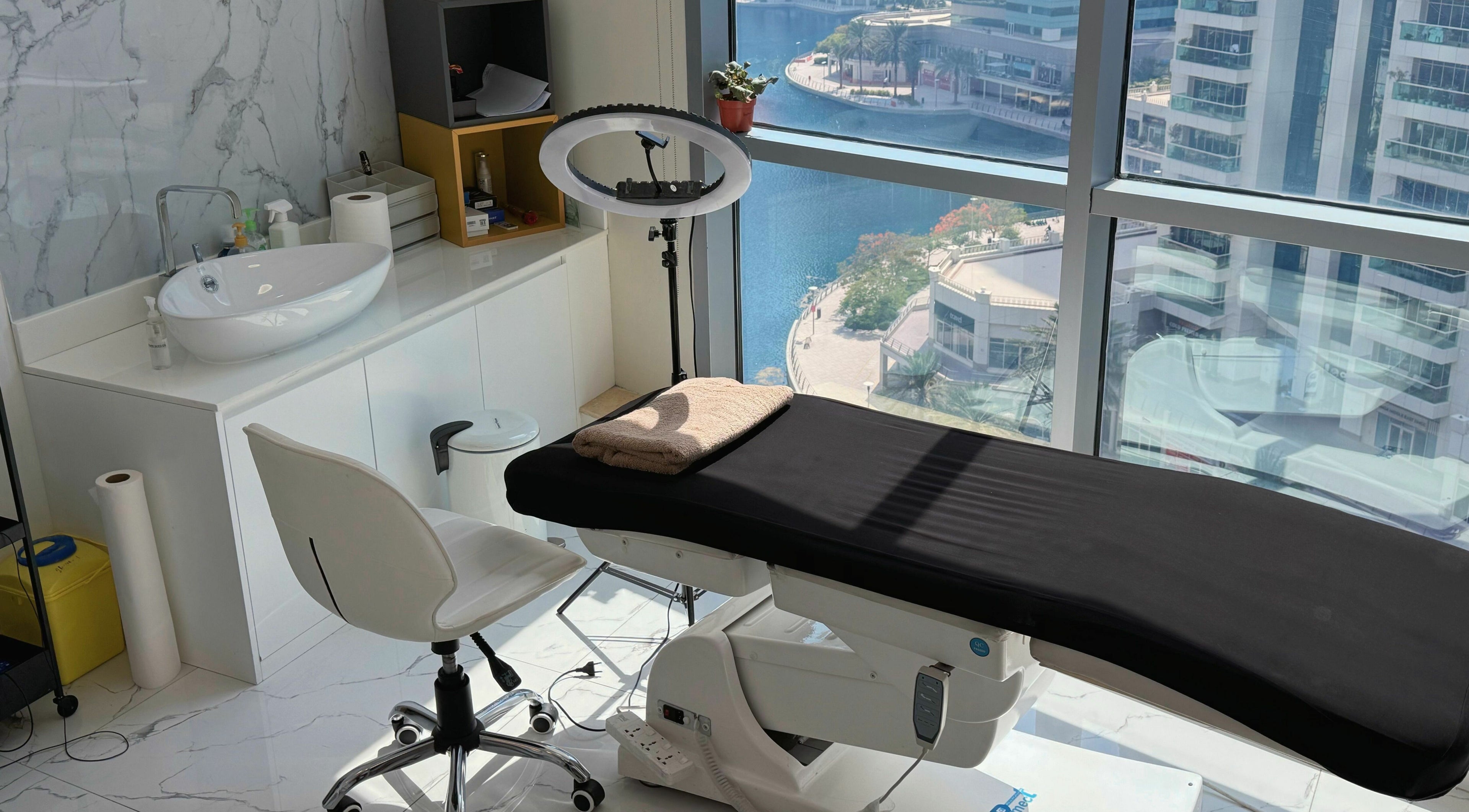 Modern treatment room at Sunface Medical Aesthetic Center, Dubai, Dubai, AE with a scenic city view.