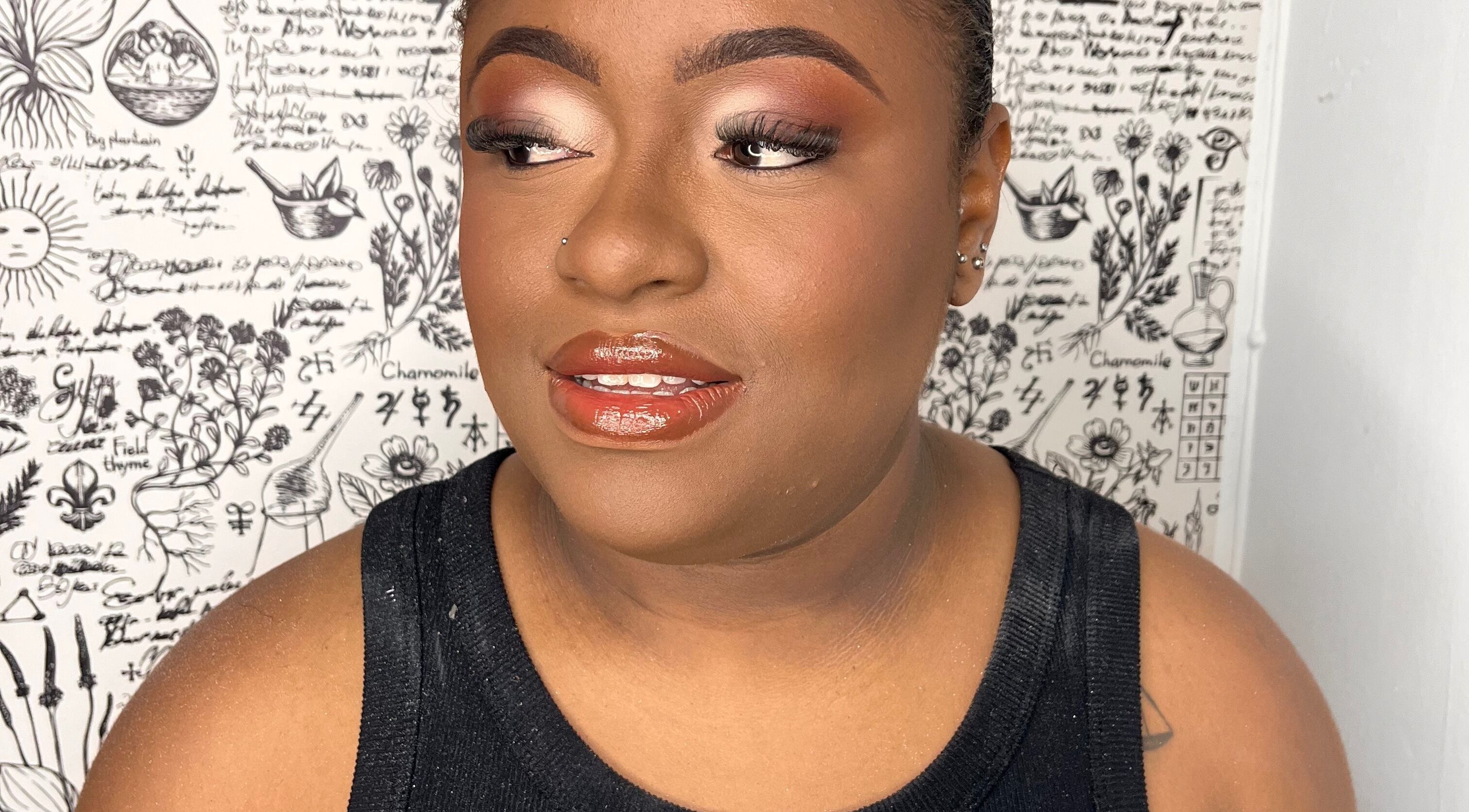 A woman with elegant makeup in Shumabelle, Willemstad, Curaçao, CW, showcasing flawless beauty.