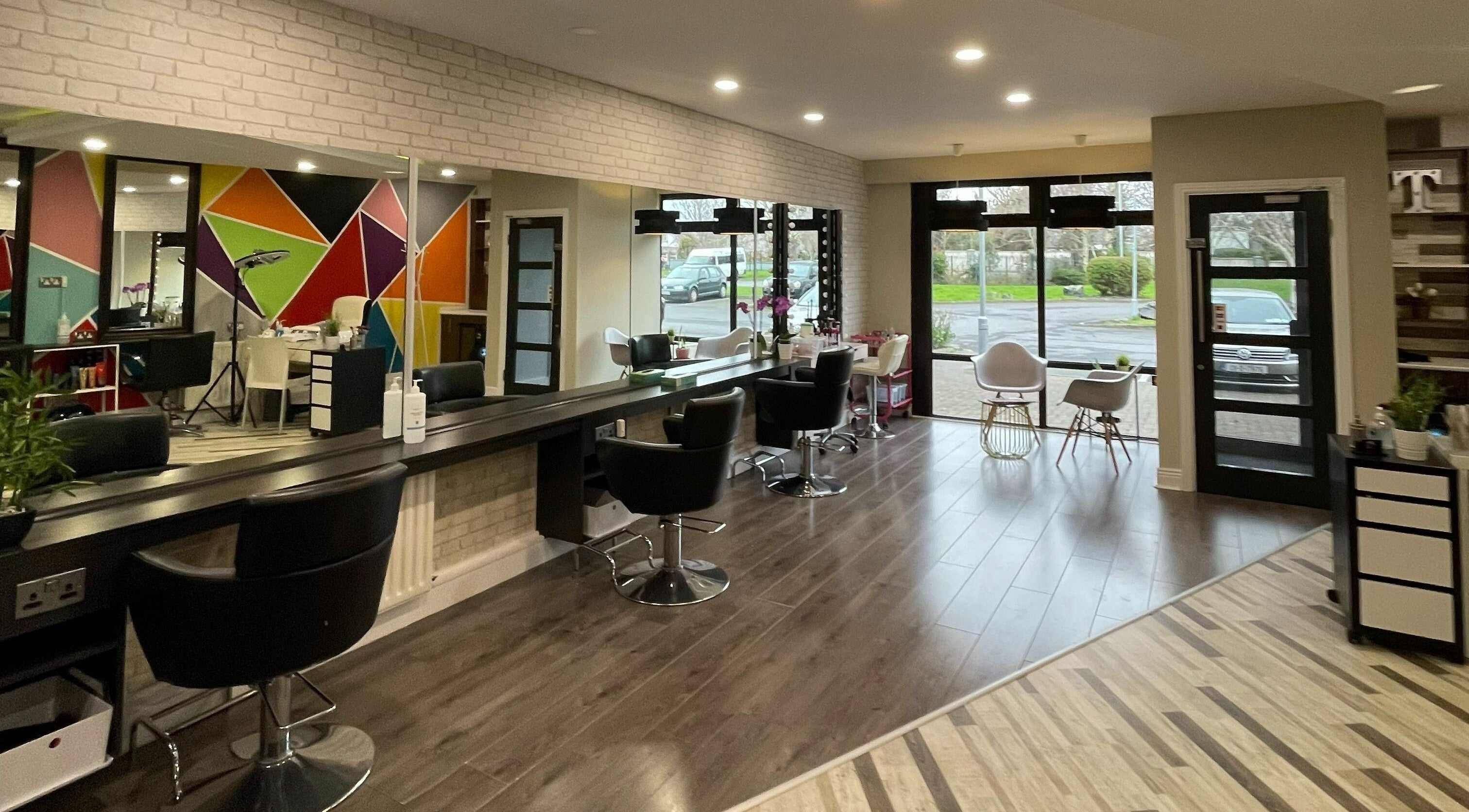 Modern interior of One Stop Salon - The Salon Finnstown in Lucan, County Dublin, IE with colorful wall design.
