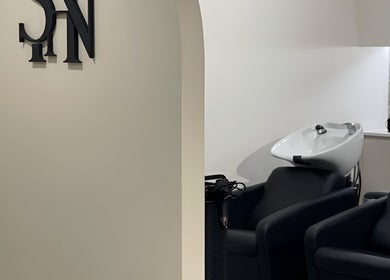 Modern salon setup at Stefanie Napoleone Hair in Peakhurst, New South Wales, AU featuring stylish washing stations.