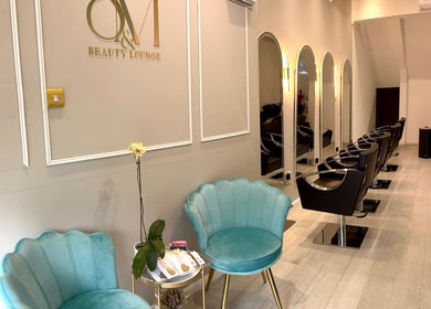 Chic interior view of S&M Beauty Lounge in London, England, GB with stylish seating and beauty stations.