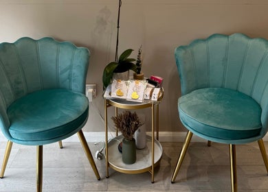 Elegant teal chairs and decor at S&M Beauty Lounge, London, England, GB, create a welcoming atmosphere.