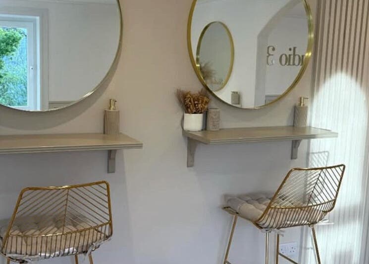Chic beauty setup at Nails By Els, Busby, Scotland, GB with stylish seating and elegant mirrors.