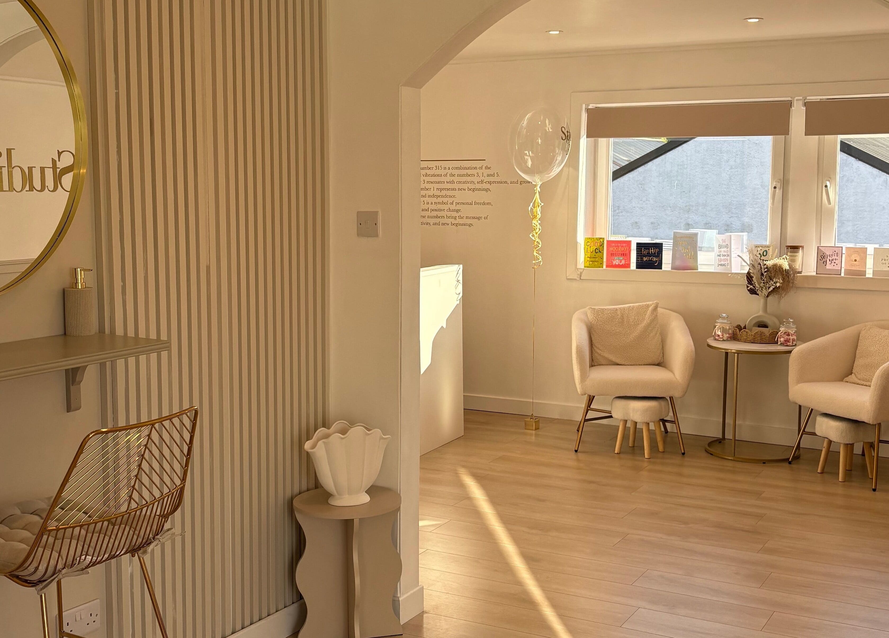 Elegant waiting area at Nails By Els, Busby, Scotland, GB, showcasing plush chairs and minimalist decor.
