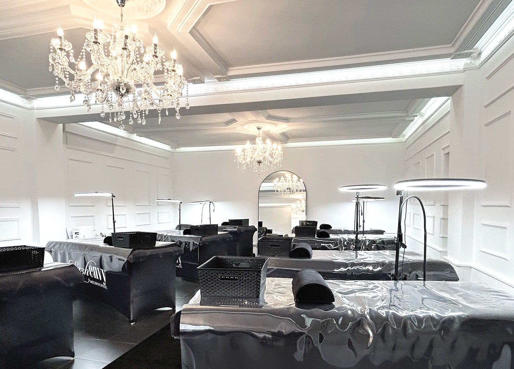 Elegant interior of Lash Envy | Oakleigh with plush beds and chandeliers in Oakleigh, VIC, AU.