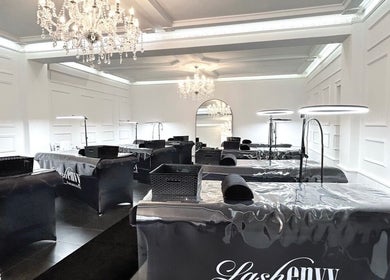 Elegant interiors of Lash Envy | Geelong in Geelong West, Victoria, AU featuring chandeliers and treatment stations.
