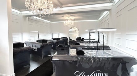 Elegant interiors of Lash Envy | Geelong in Geelong West, Victoria, AU featuring chandeliers and treatment stations.