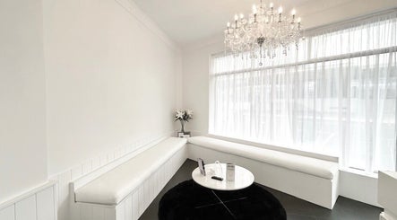 Elegant waiting area at Lash Envy | Geelong with chandelier in Geelong West, Victoria, AU.