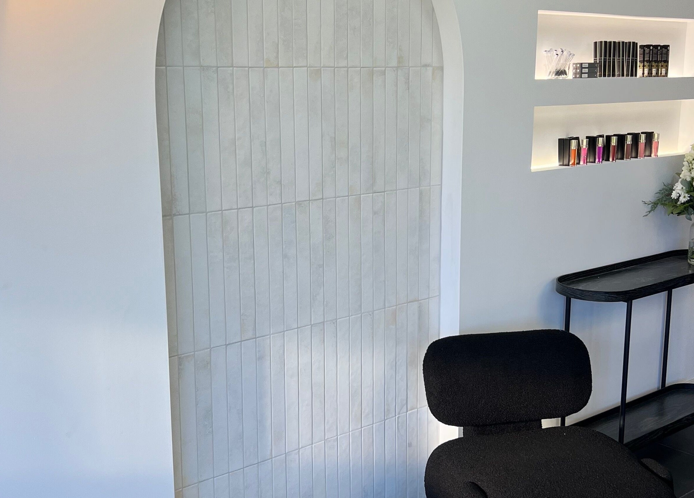 Elegant interior of Lash Envy | Geelong, featuring a stylish chair and floral decor, located in Geelong West, Victoria, AU.