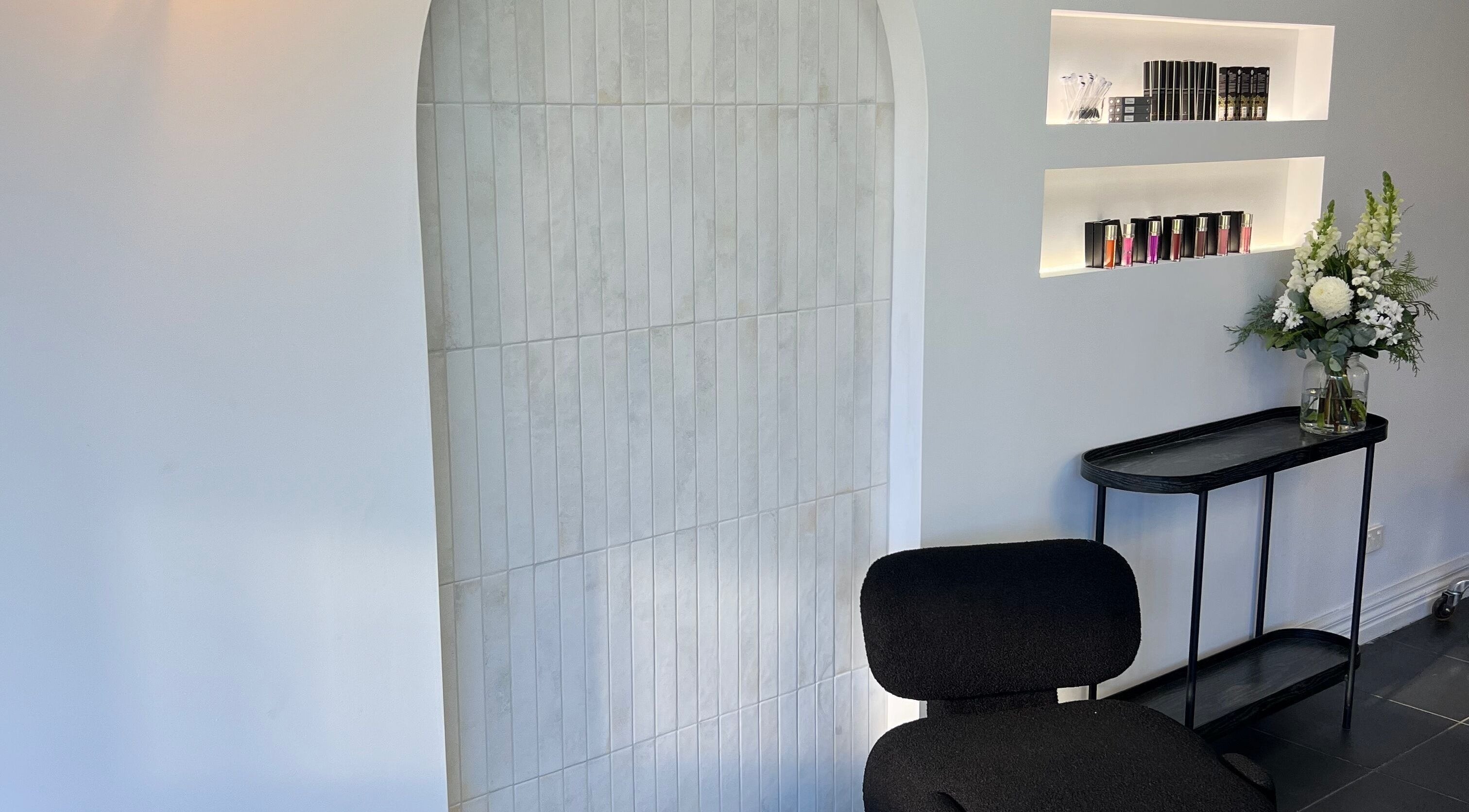 Elegant interior of Lash Envy | Geelong, featuring a stylish chair and floral decor, located in Geelong West, Victoria, AU.