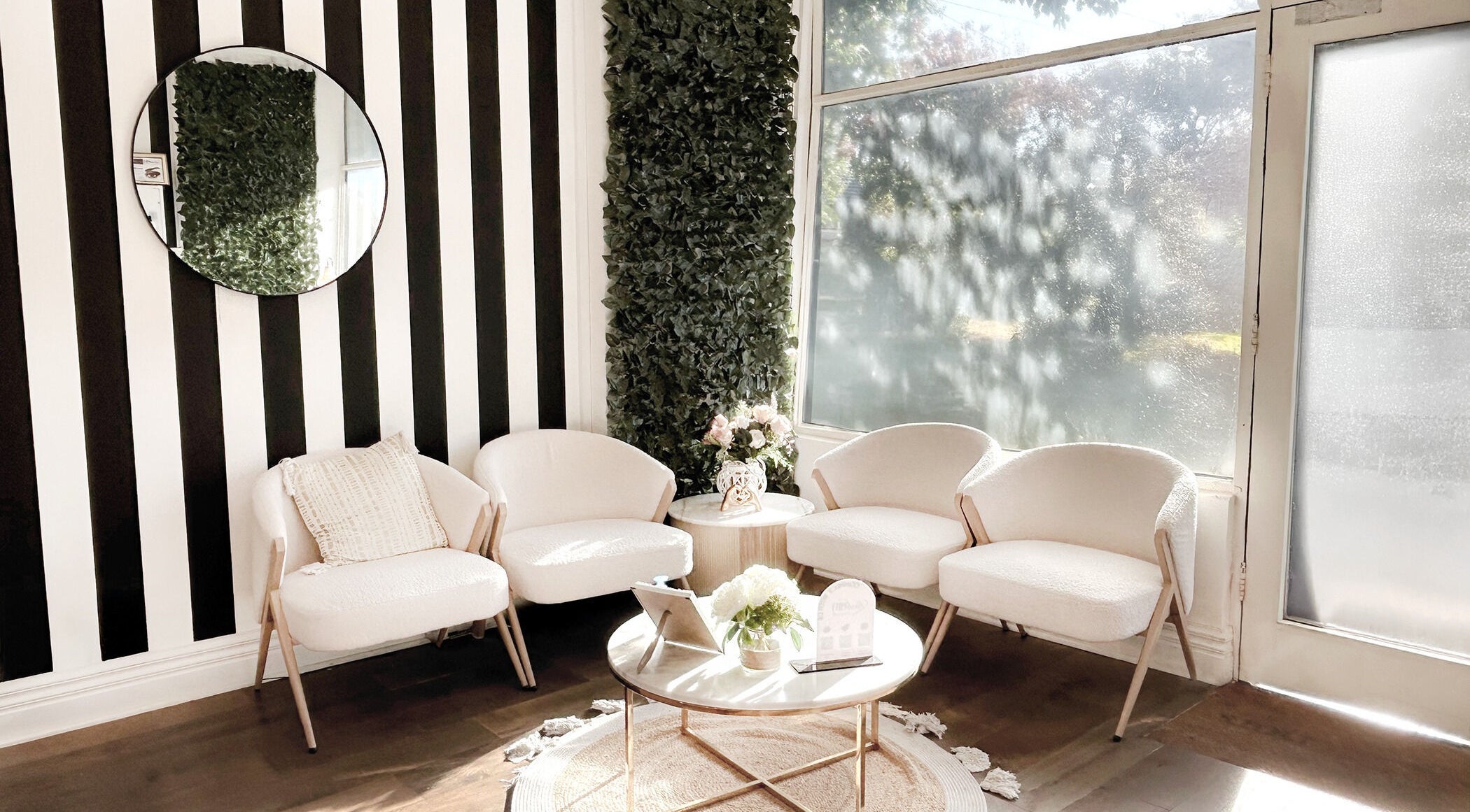 Chic, cozy waiting area at Lash Envy | Hampton, located in Hampton, VIC, AU, with stylish chairs and decor.