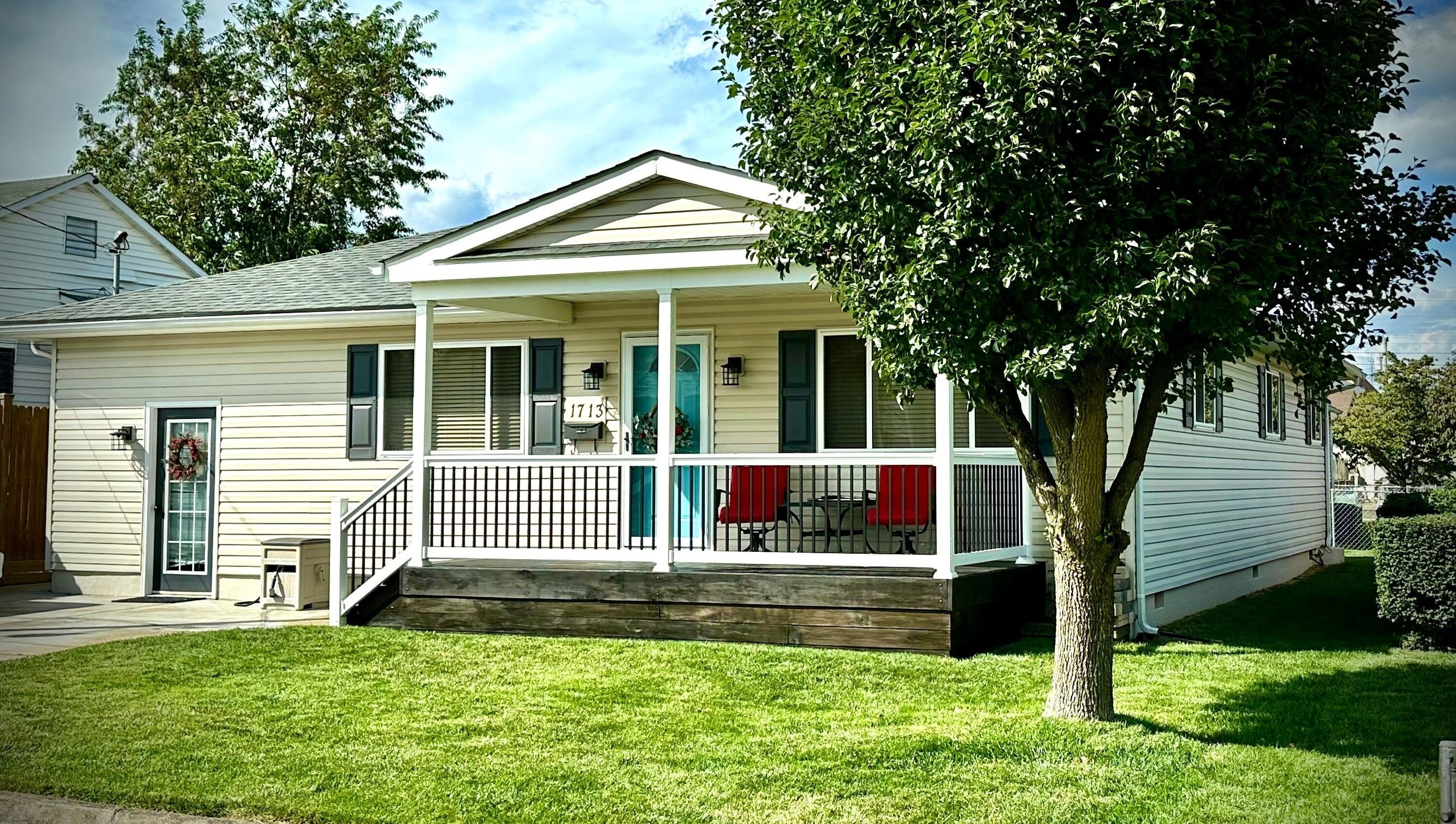 Charming white exterior of SeptemberS Salon - Nitro, Nitro, West Virginia, US, with lush green lawn.