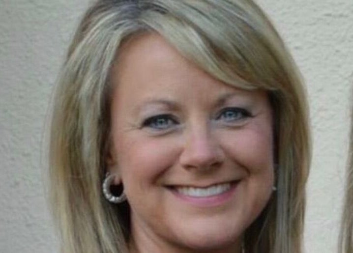 Smiling woman at SeptemberS Salon - Nitro, enhancing beauty in Nitro, West Virginia, US.