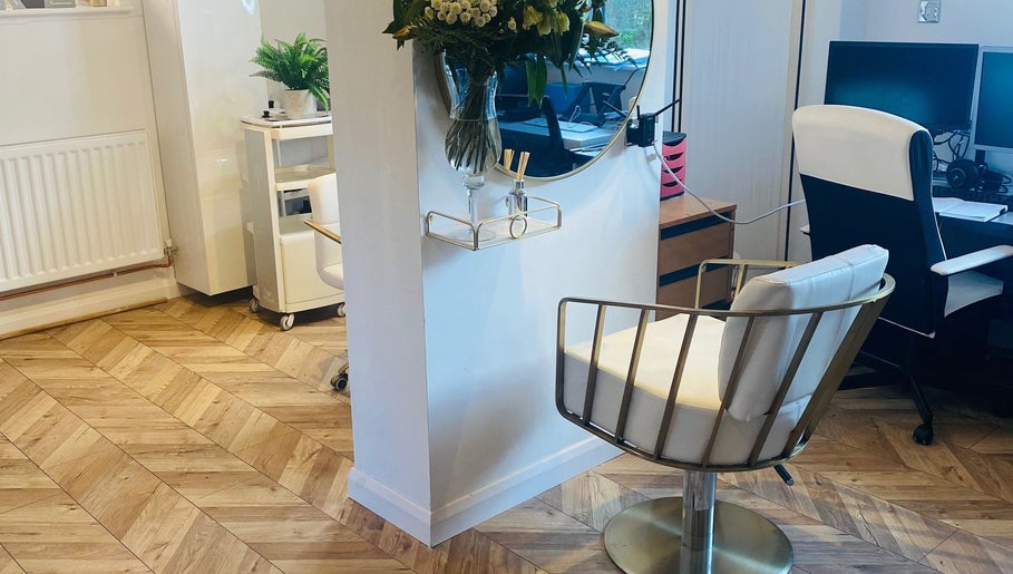 Elegant interior of Hairworkz Hairdressing in Rode Heath, England, GB featuring stylish seating and decor.