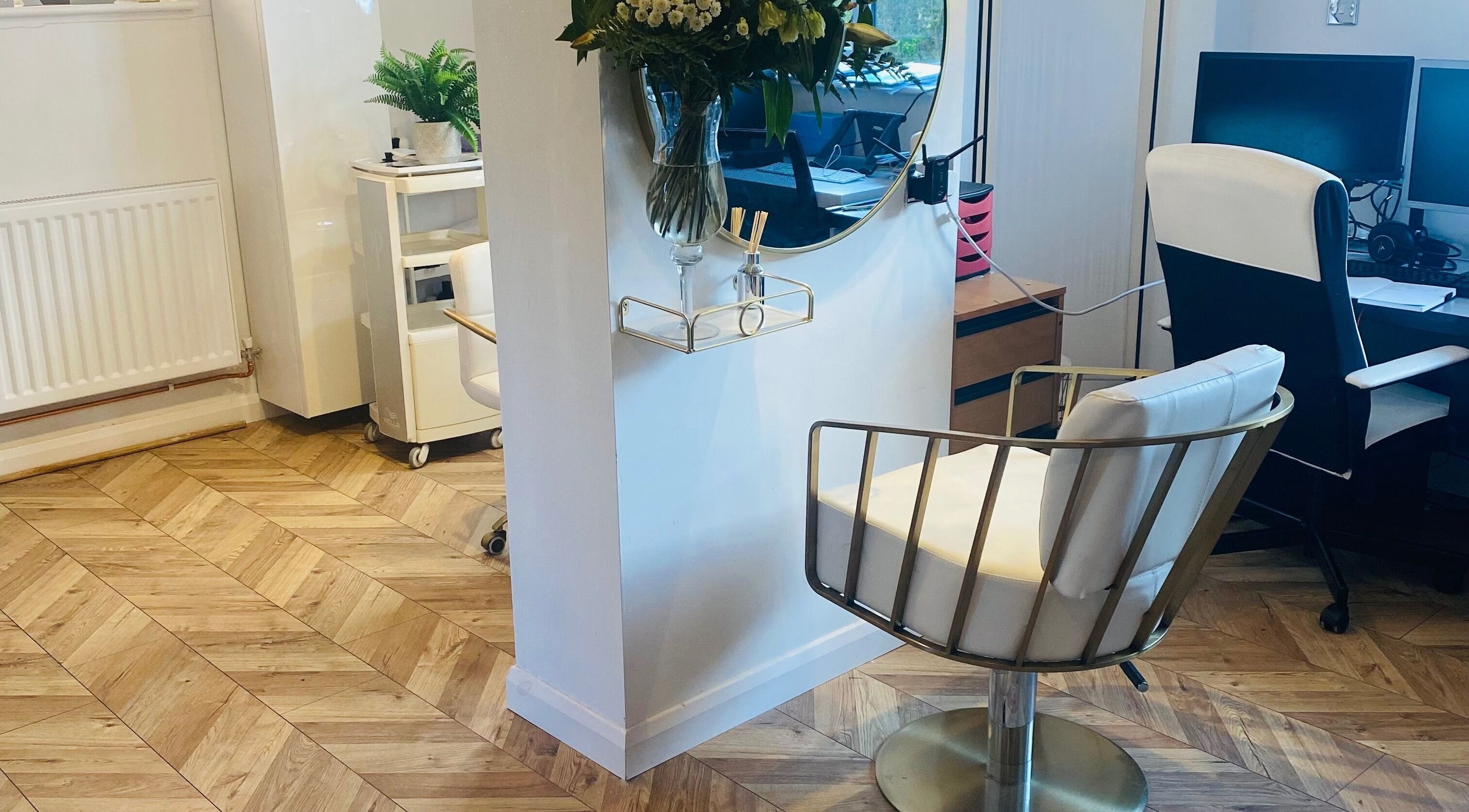 Elegant interior of Hairworkz Hairdressing in Rode Heath, England, GB featuring stylish seating and decor.