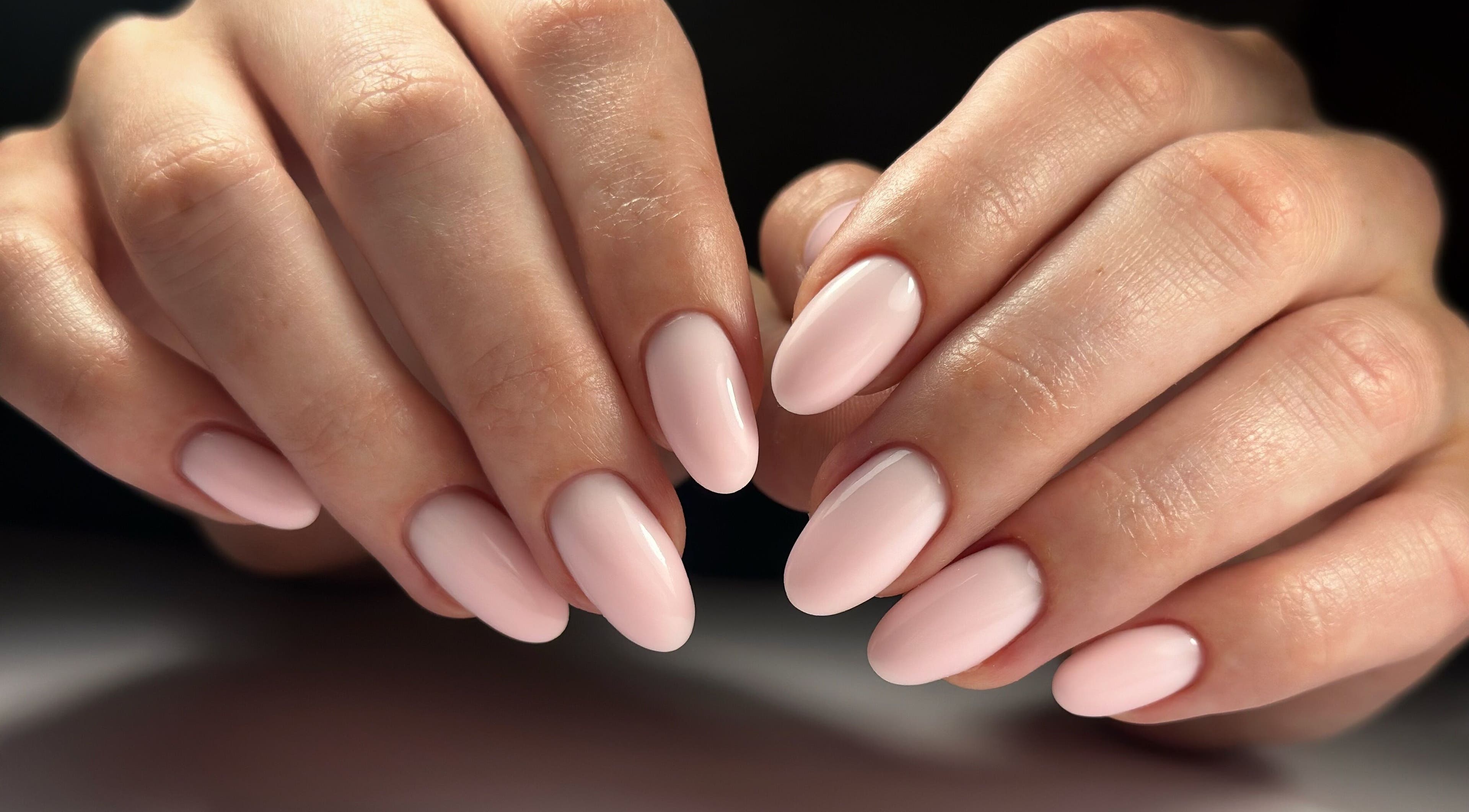 Close-up of elegant pale pink nails from Lordna Nails, Hamilton, Queensland, AU reflecting top-notch manicure.