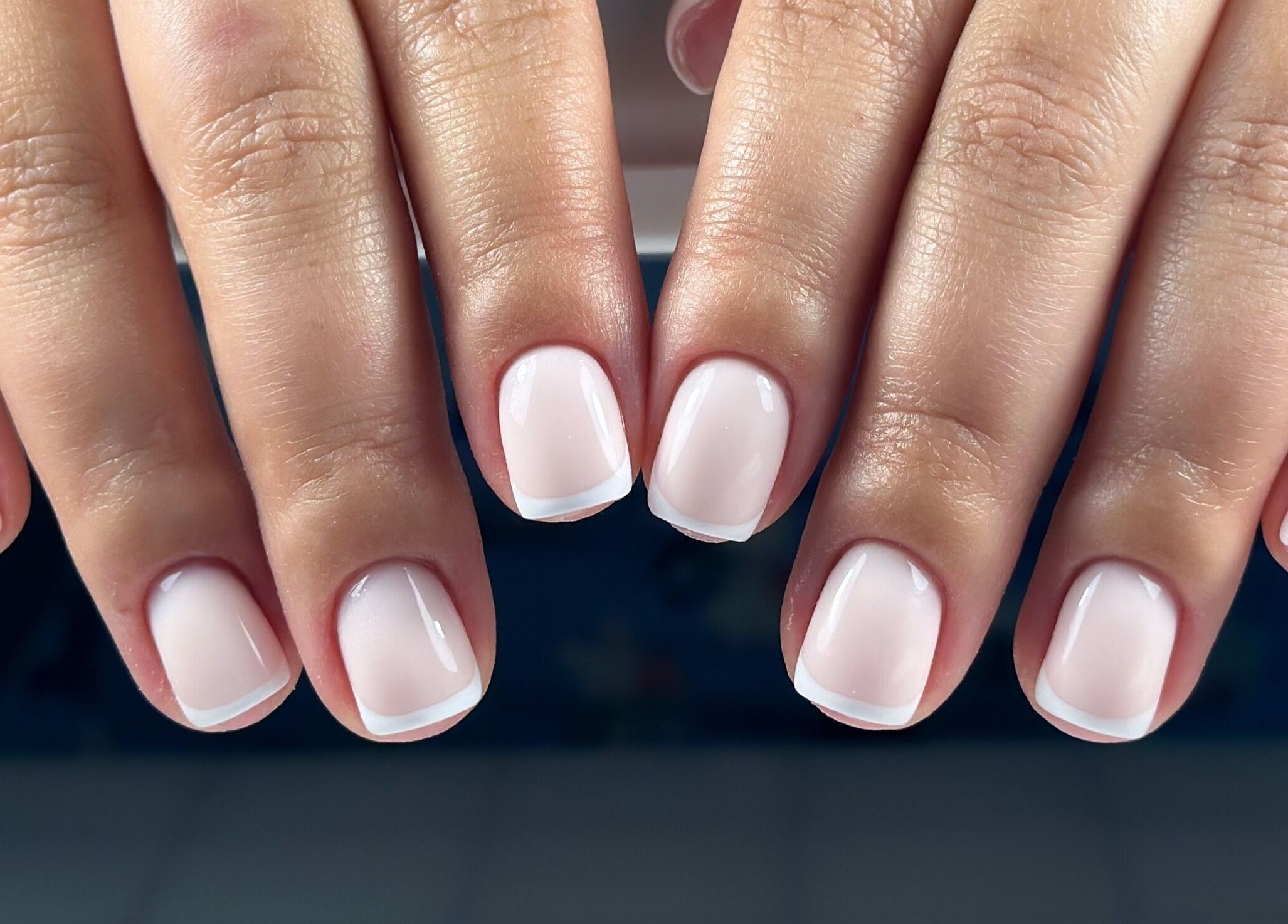 Classic French manicure at Lordna Nails, Hamilton, Queensland, AU, showcasing pristine white tips and glossy finish.