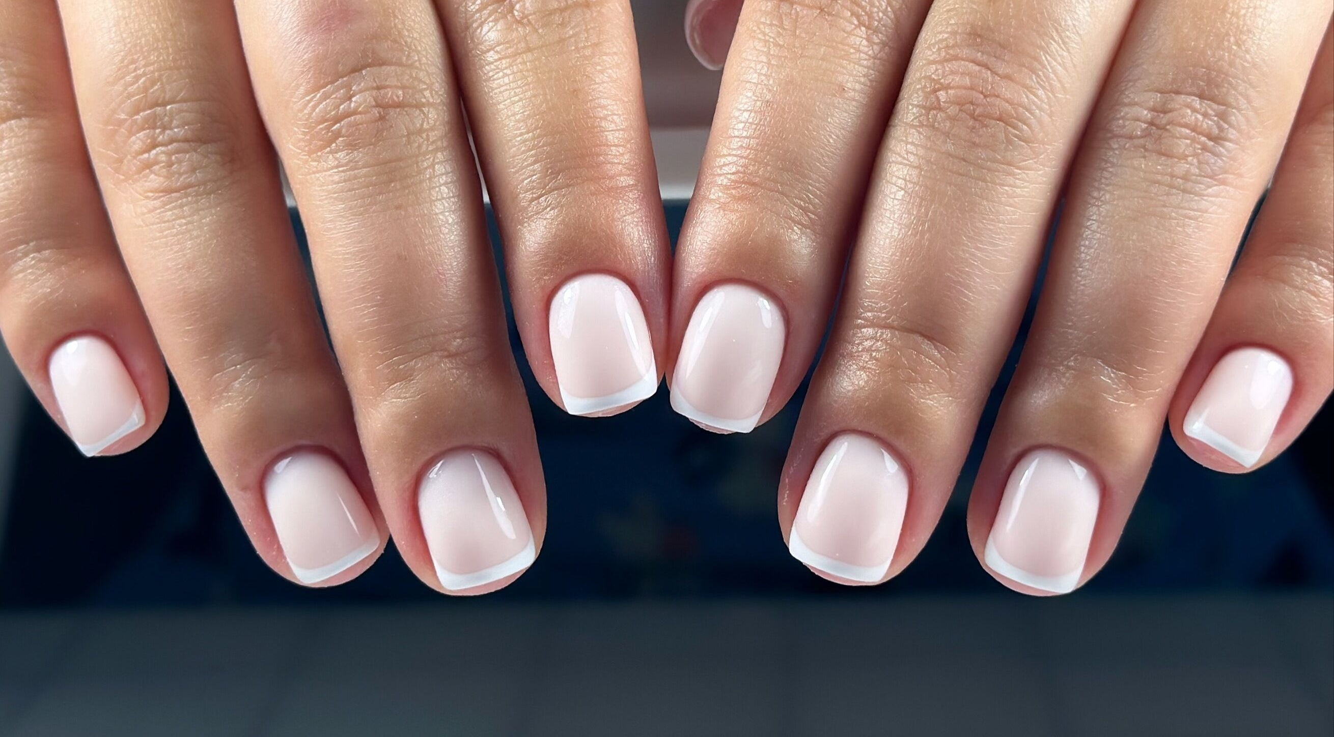 Classic French manicure at Lordna Nails, Hamilton, Queensland, AU, showcasing pristine white tips and glossy finish.