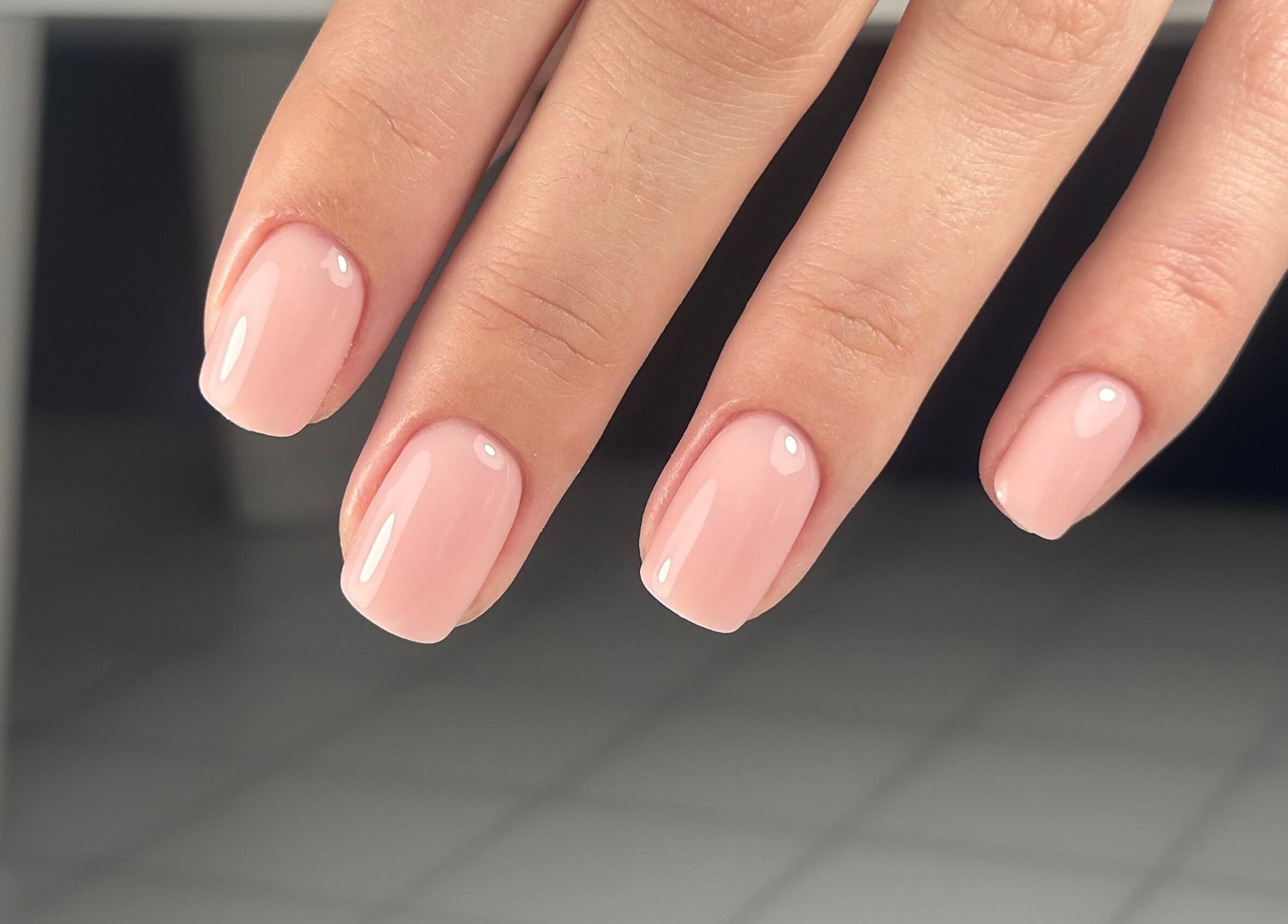 Elegant pink manicure at Lordna Nails, Hamilton, Queensland, AU, showcasing glossy nail art expertise.