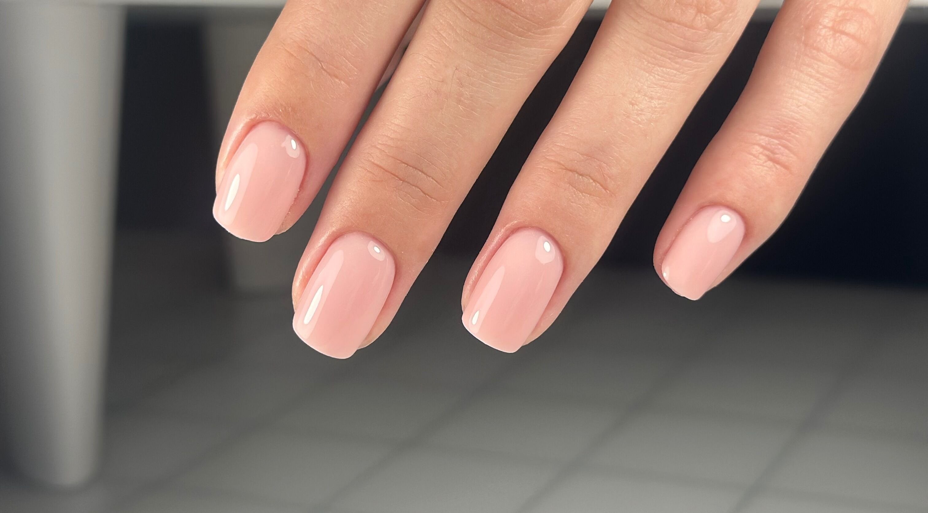 Elegant pink manicure at Lordna Nails, Hamilton, Queensland, AU, showcasing glossy nail art expertise.