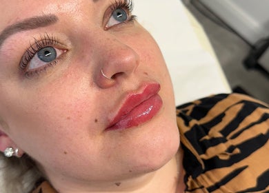 Client after lip enhancement at PRETTY LITTLE FACES nurse led beauty clinic, Desborough, England, GB.