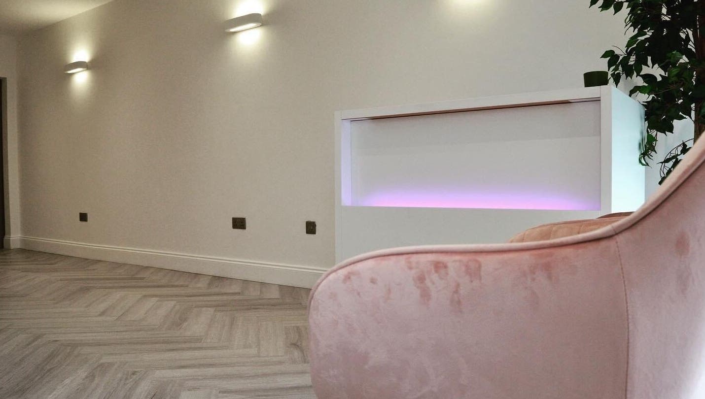 AP Beauty's elegant reception area in Ayr, Scotland featuring modern design and soft lighting ambiance.