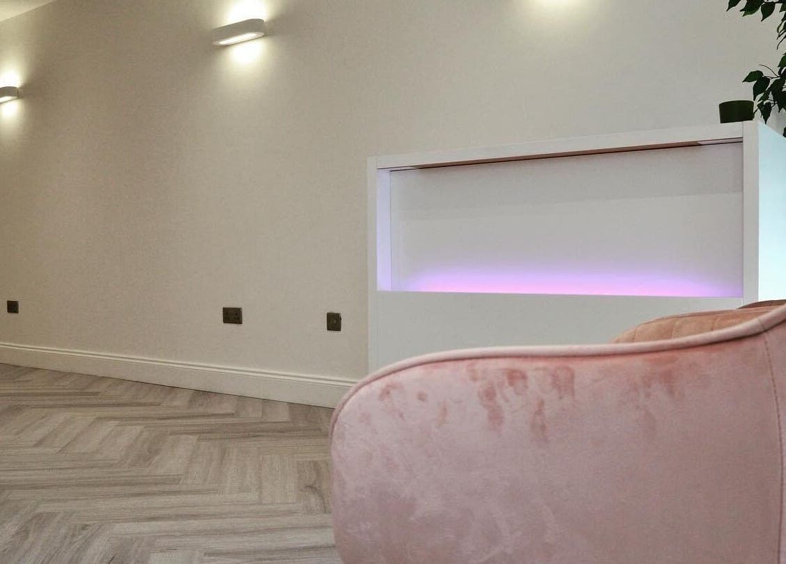 AP Beauty's elegant reception area in Ayr, Scotland featuring modern design and soft lighting ambiance.