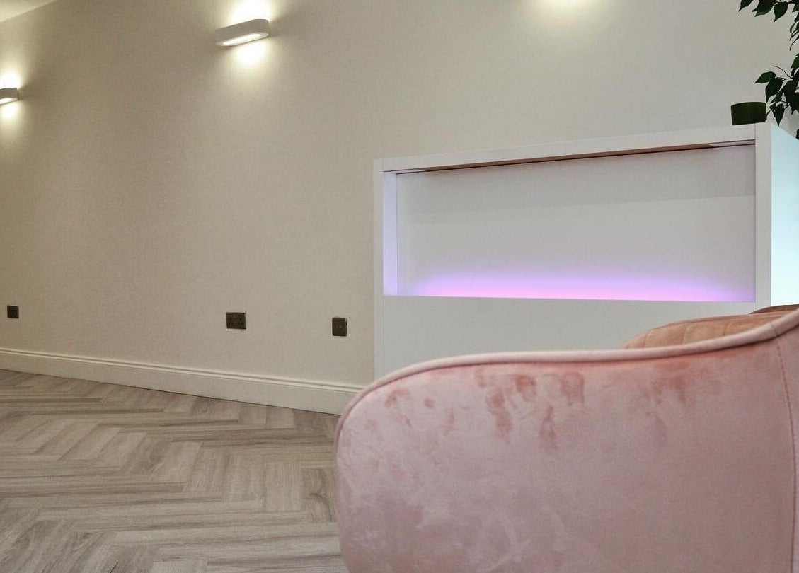 AP Beauty's elegant reception area in Ayr, Scotland featuring modern design and soft lighting ambiance.
