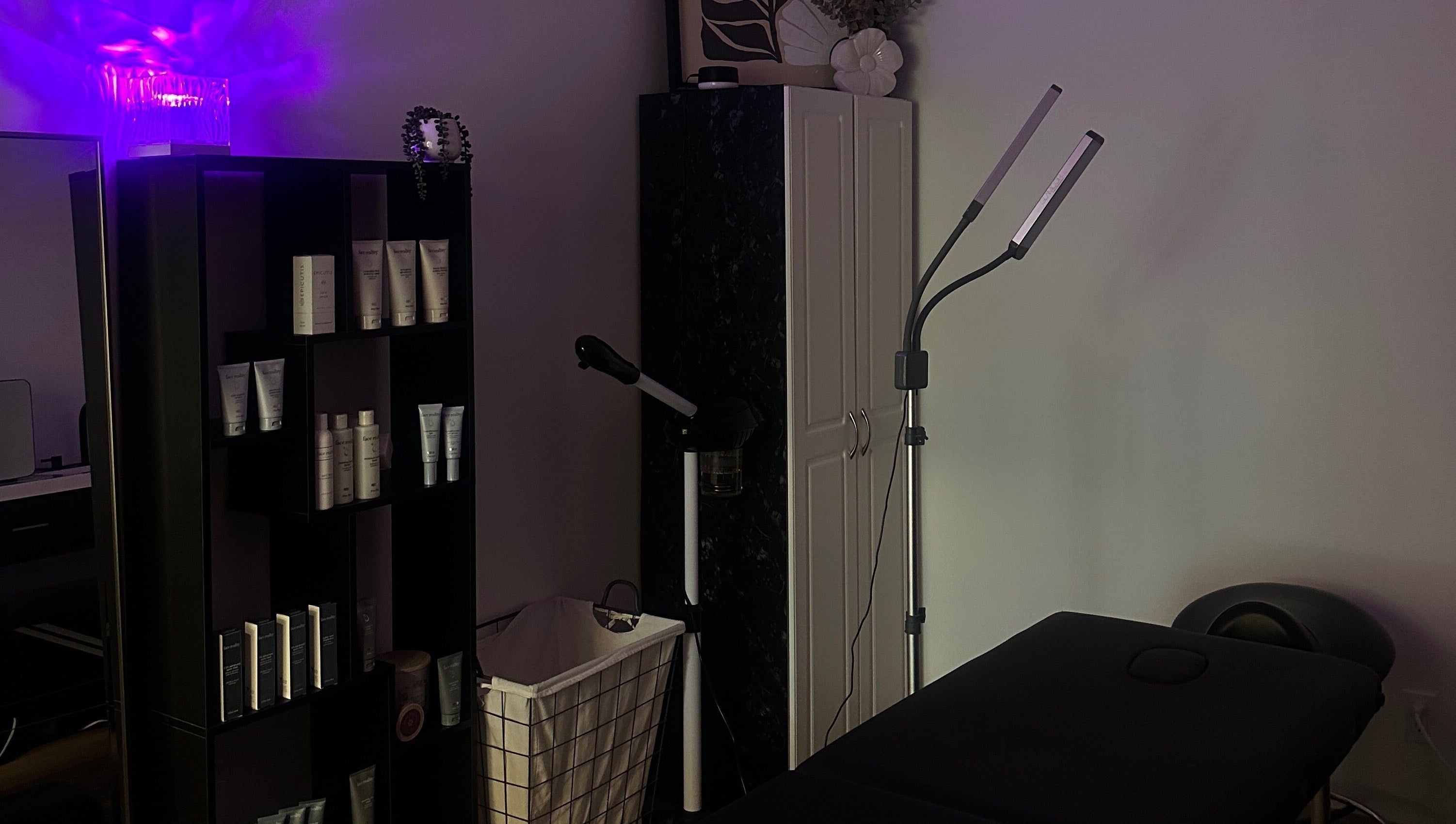 Em's Esthetics in Pleasant Grove, Utah, US, showcasing a tranquil treatment room with skincare products and soft lighting.