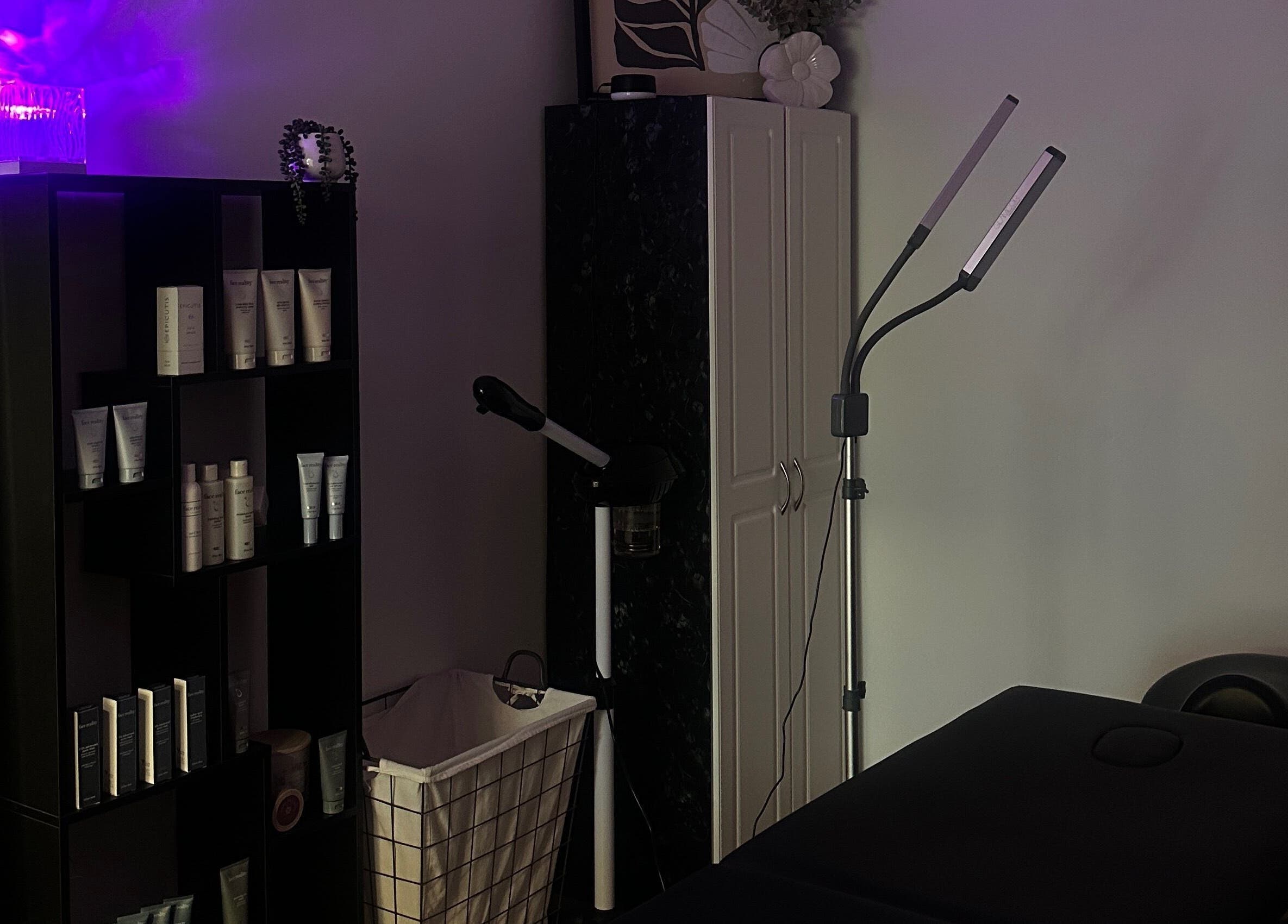 Em's Esthetics in Pleasant Grove, Utah, US, showcasing a tranquil treatment room with skincare products and soft lighting.
