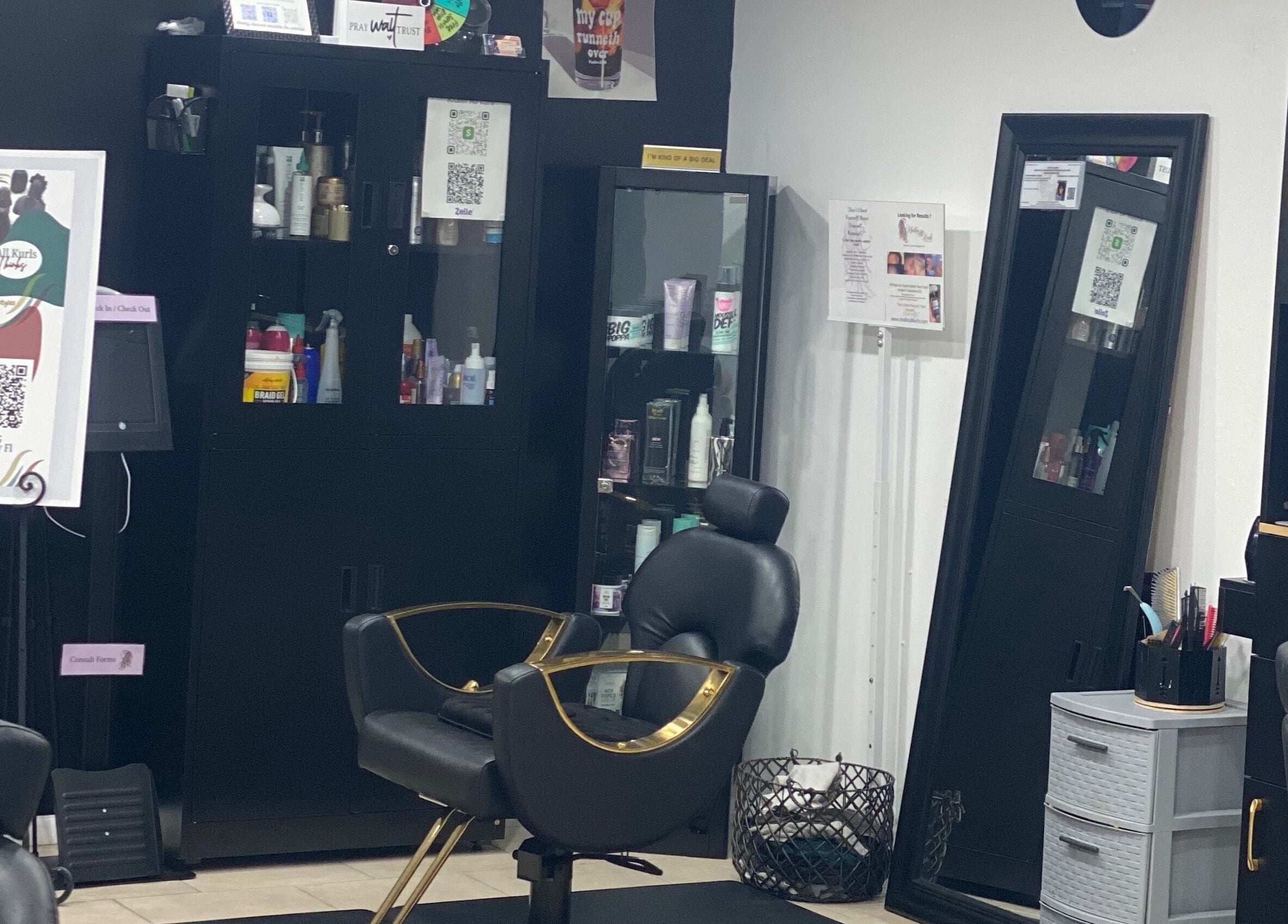 Khallin All Kurls Natural Kinks salon interior showcasing styling chairs and product shelves in New Port Richey, Florida.