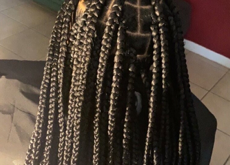 Intricate braids crafted at Khallin All Kurls Natural Kinks, New Port Richey, Florida, US.