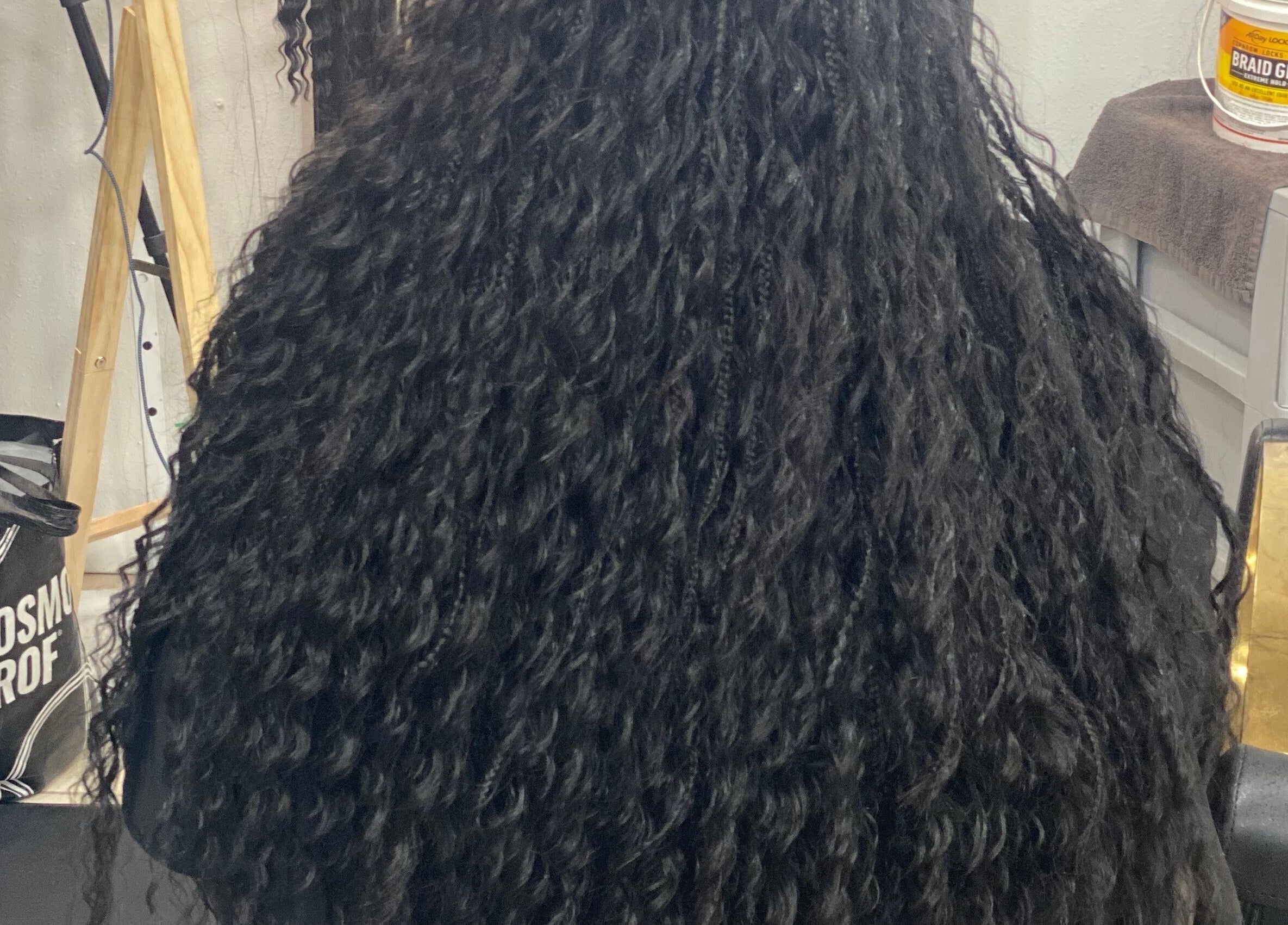 Rich, curly hairstyle showcased at Khallin All Kurls Natural Kinks, New Port Richey, Florida, US.