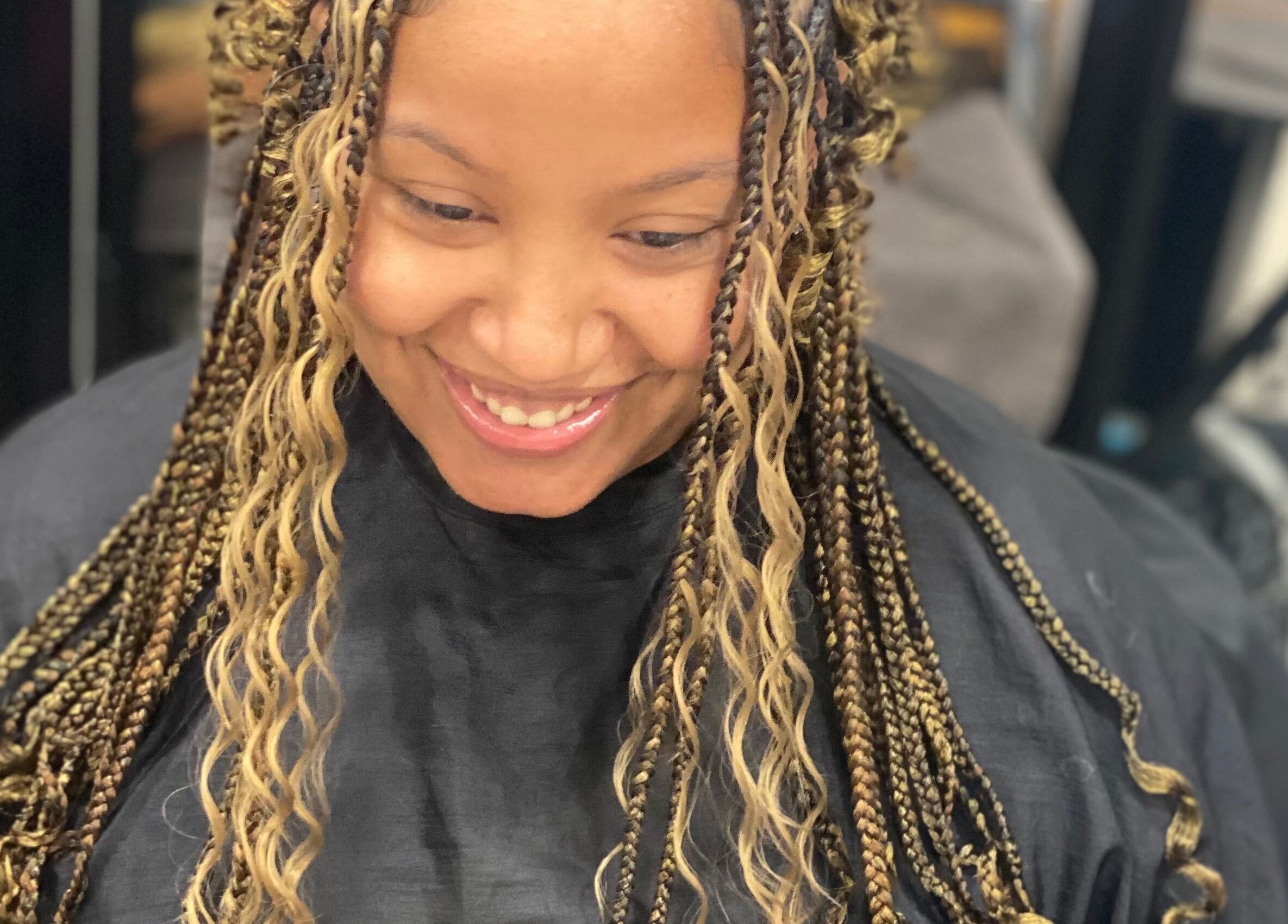 Stylish braided hairstyle at Khallin All Kurls Natural Kinks in New Port Richey, Florida, US.