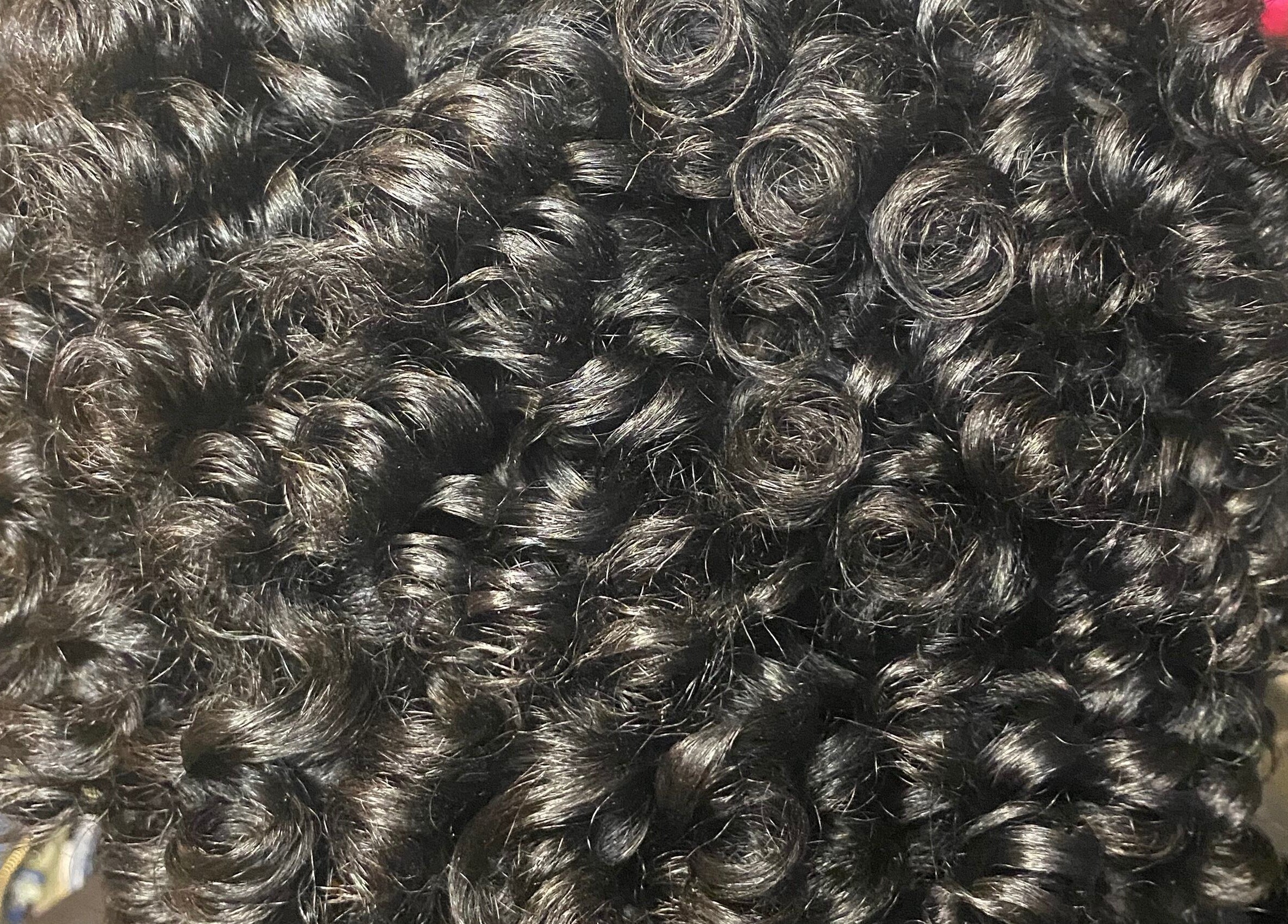 Close-up of glossy curls styled at Khallin All Kurls Natural Kinks, New Port Richey, Florida, US.