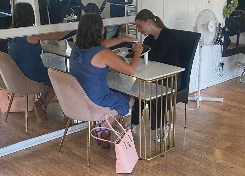 Customer receiving manicure at Beauty by Francesca, Tranent, Scotland, GB in elegant salon setting.