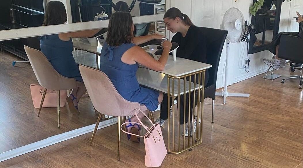 Customer receiving manicure at Beauty by Francesca, Tranent, Scotland, GB in elegant salon setting.