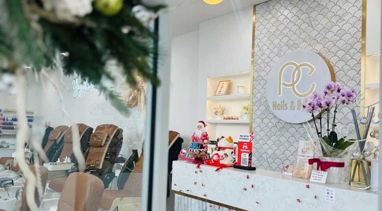 PC Nails and Beauty welcoming reception area adorned with festive decor in Newington, New South Wales, AU.