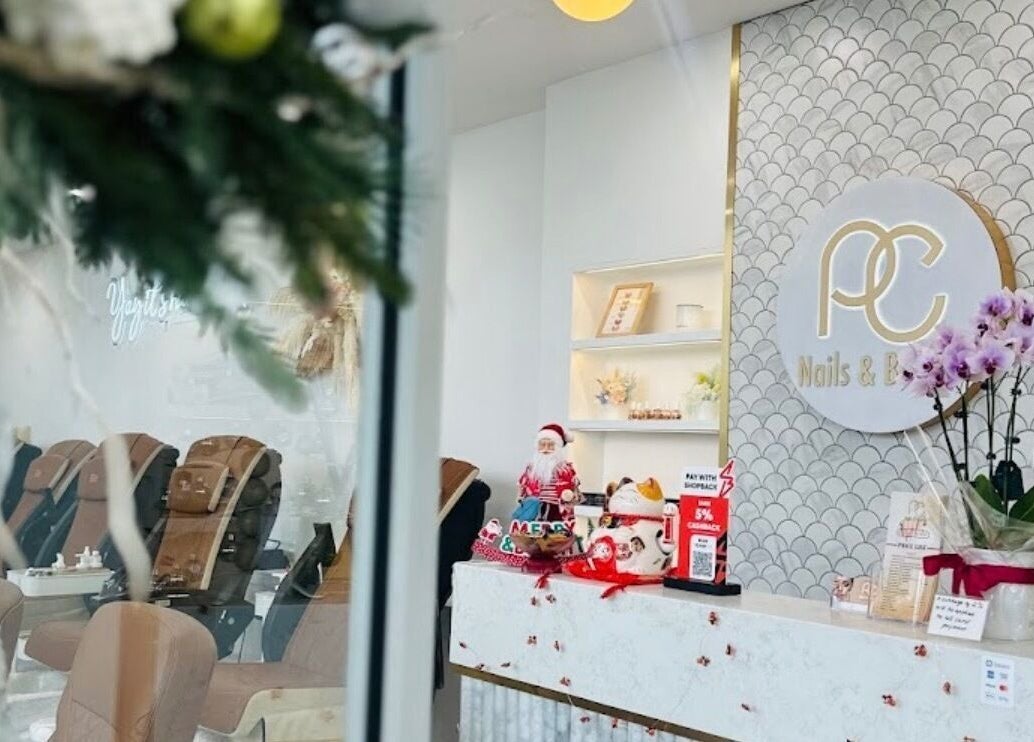 Luxurious interior of PC Nails and Beauty in Newington, New South Wales, AU, featuring elegant decor and seating.