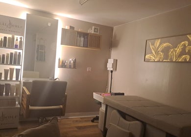 Interior of The Hair Cabin, Featherstone, England, GB, featuring chic styling area and Neal & Wolf products.