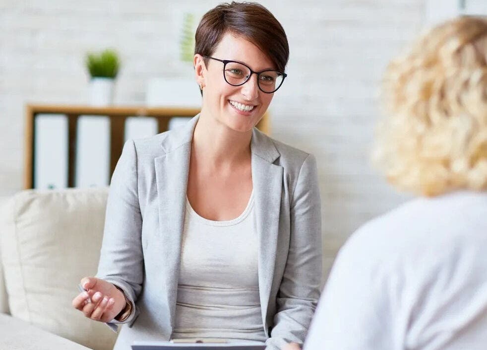 Counselor at Women's Counselling Services, Ormeau, Queensland, AU with a client, fostering a supportive environment.