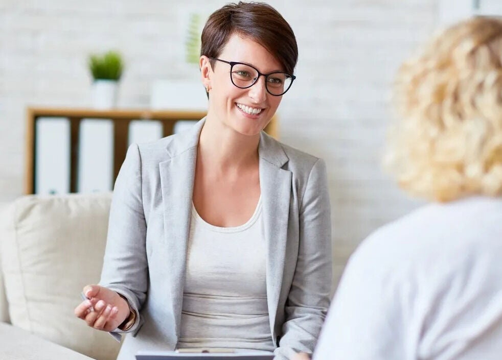 Counselor at Women's Counselling Services, Ormeau, Queensland, AU with a client, fostering a supportive environment.