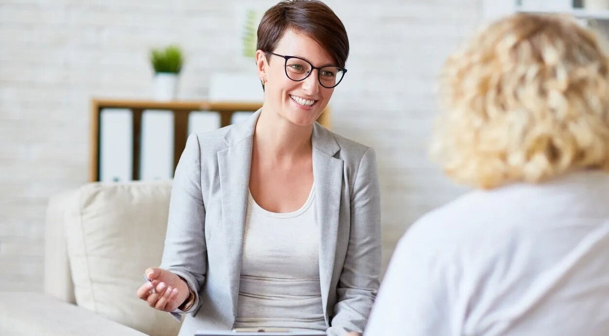 Counselor at Women's Counselling Services, Ormeau, Queensland, AU with a client, fostering a supportive environment.