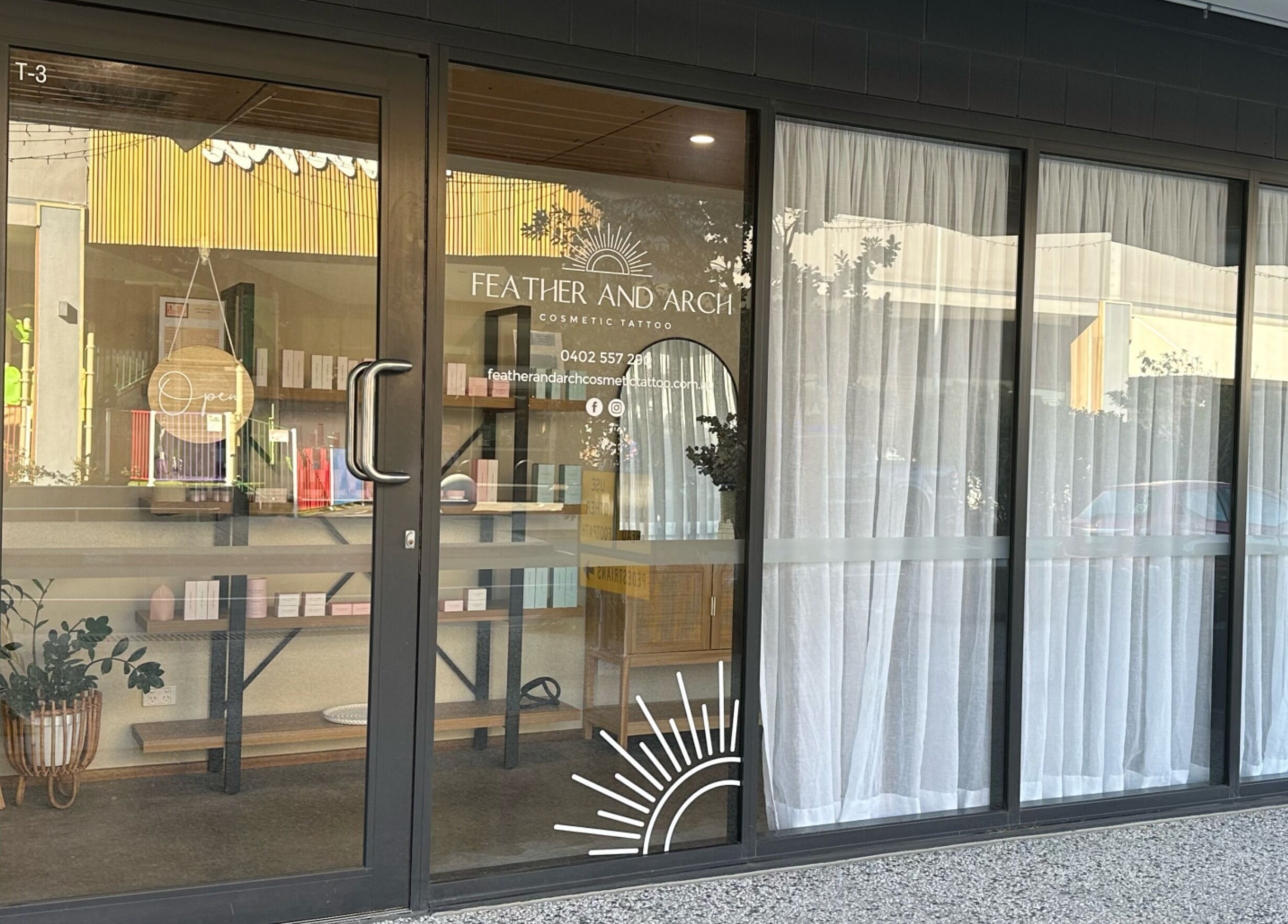 Feather and Arch Cosmetic Tattoo entrance in Mooloolaba, Queensland, AU, welcoming clients with style.