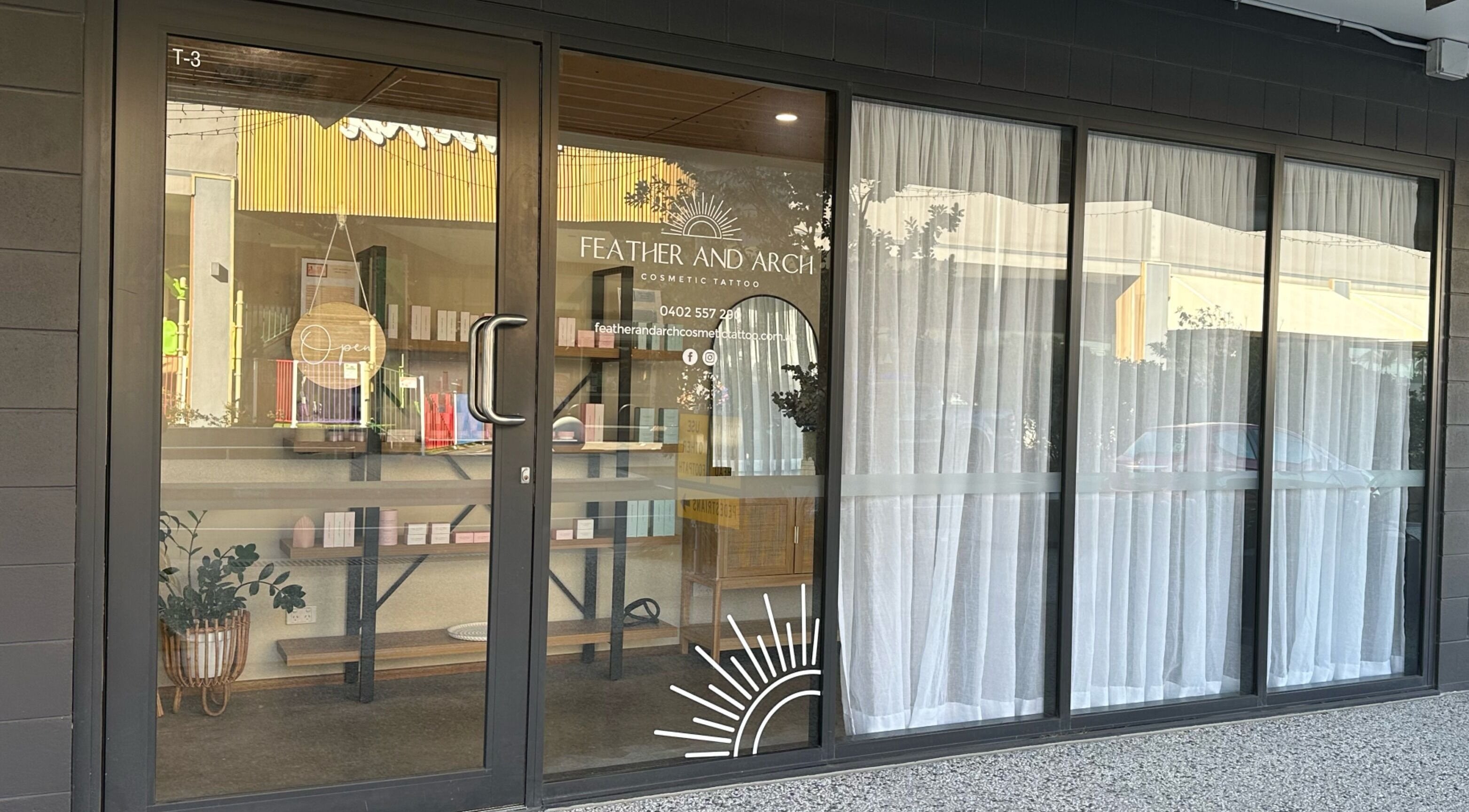 Feather and Arch Cosmetic Tattoo entrance in Mooloolaba, Queensland, AU, welcoming clients with style.