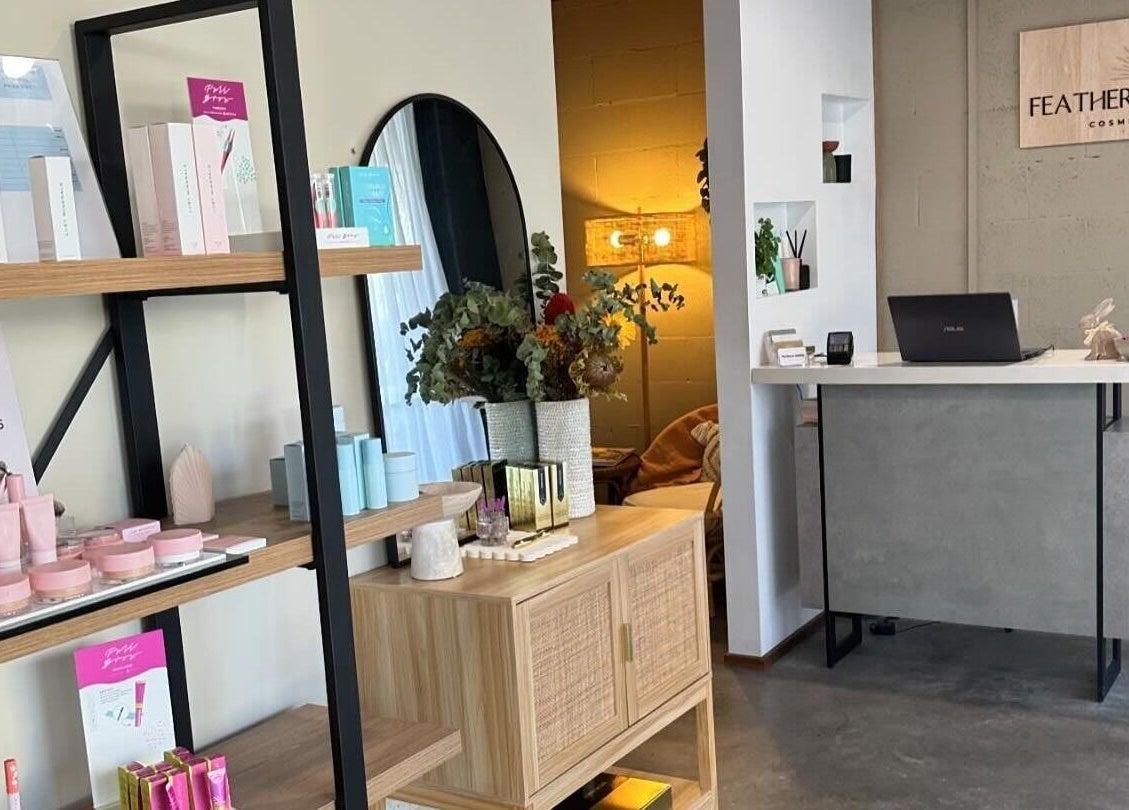Modern interior of Feather and Arch Cosmetic Tattoo in Mooloolaba, Queensland, AU with chic decor and display products.