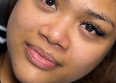 Close-up of a client showcasing lash extensions at Dolled Up By Em, Oxspring, England, GB.