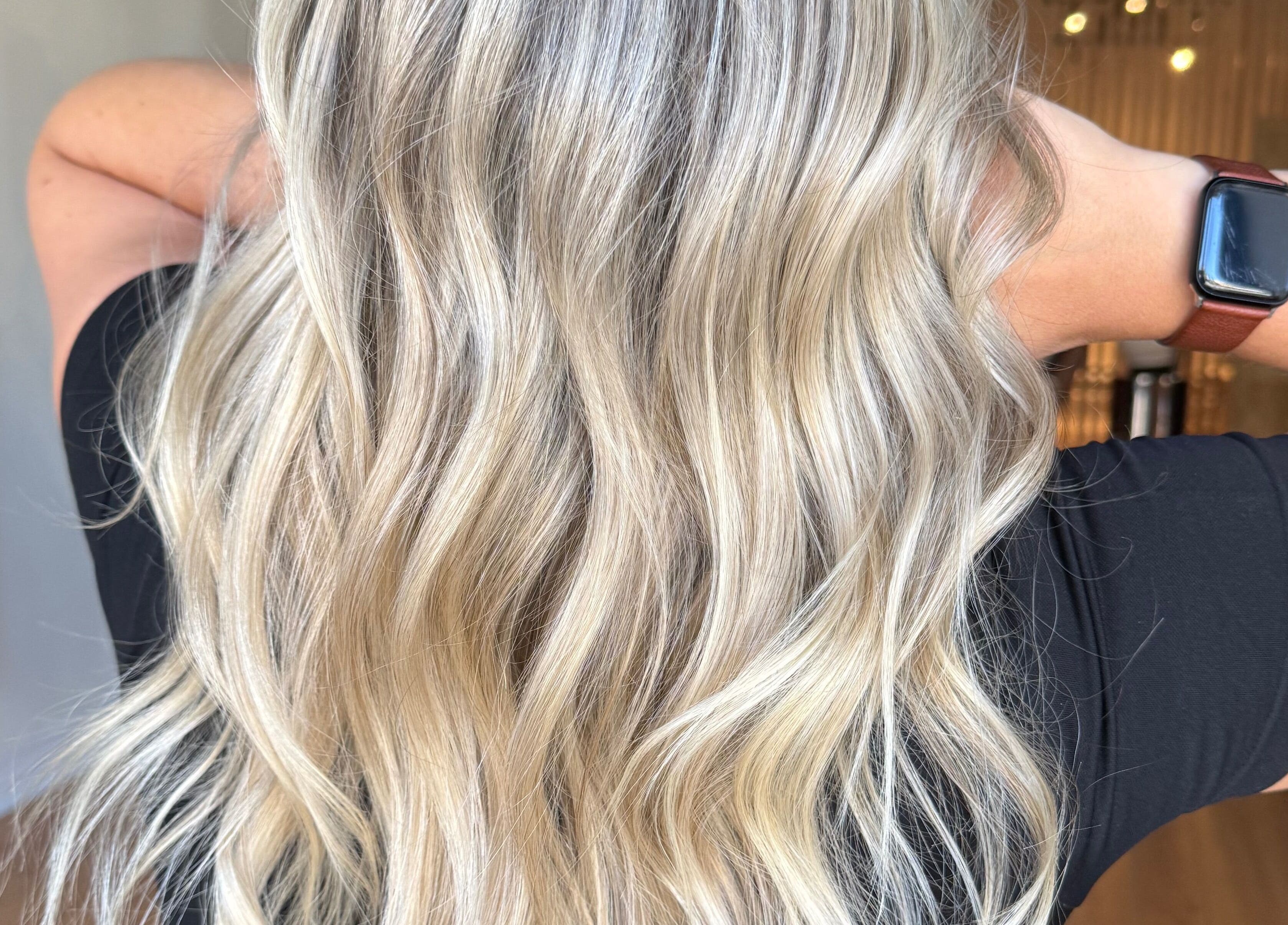 Blonde wavy hairstyle at Jazzy Cutz in St Catharines, Ontario, CA, showcasing vibrant and healthy hair.