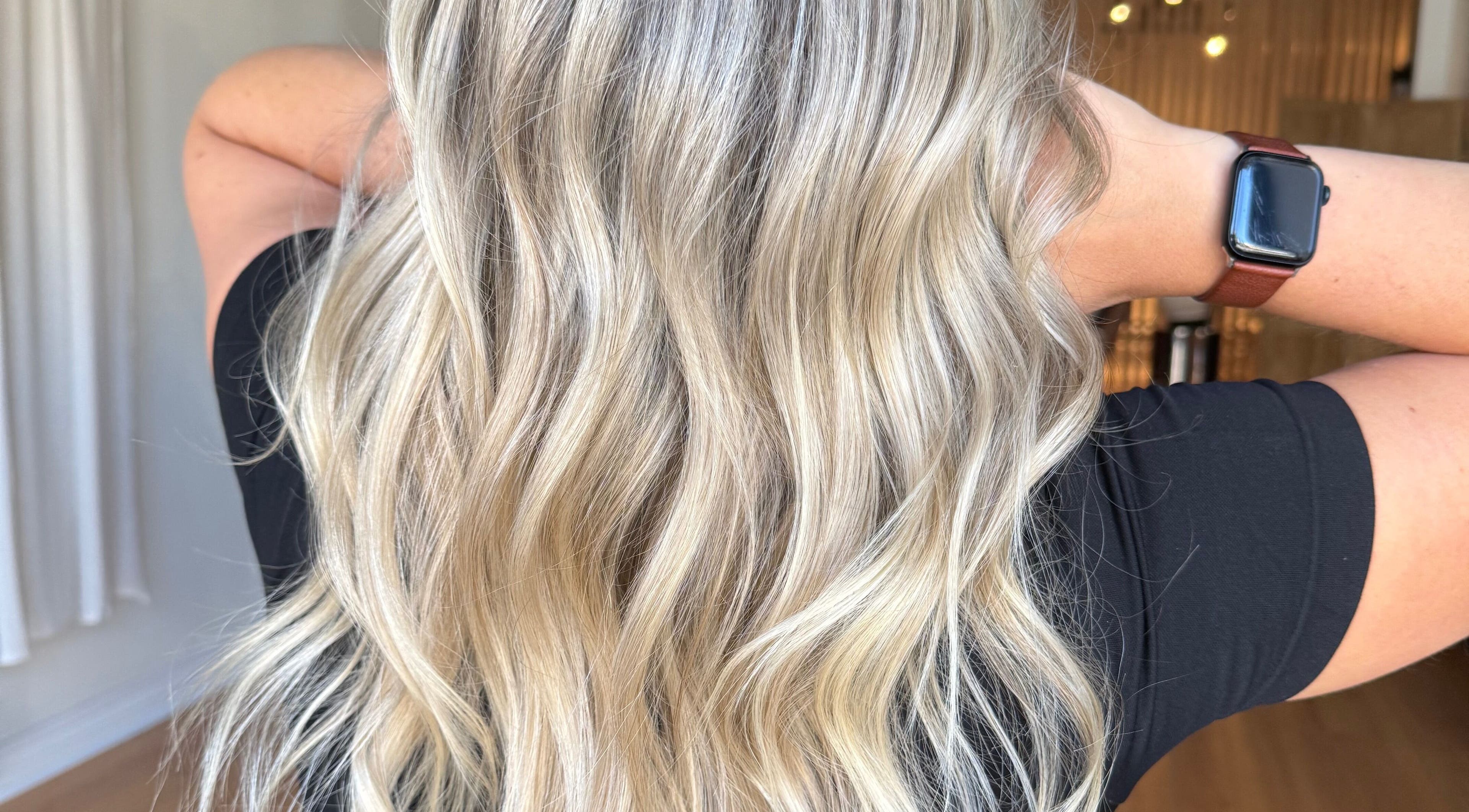 Blonde wavy hairstyle at Jazzy Cutz in St Catharines, Ontario, CA, showcasing vibrant and healthy hair.