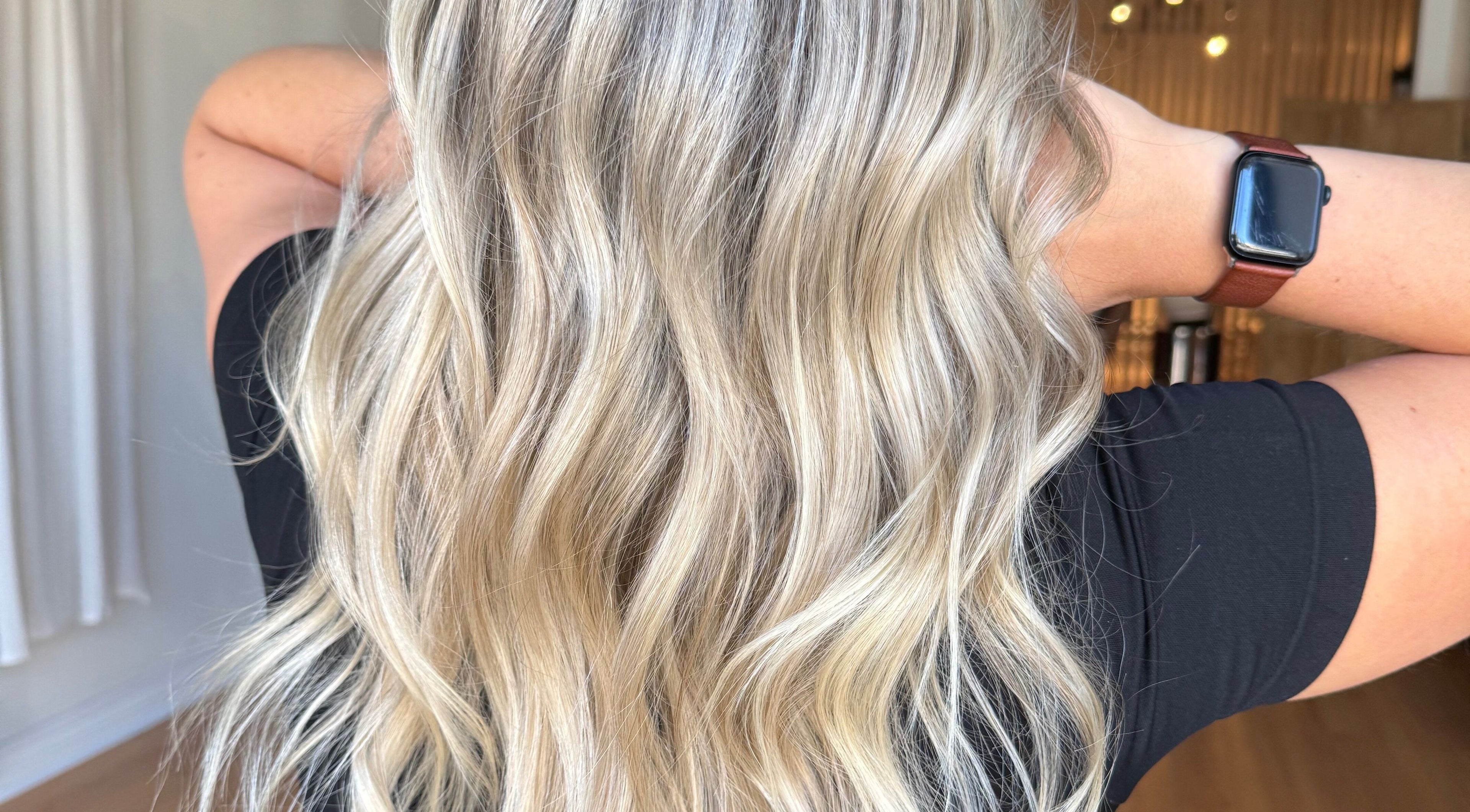 Blonde wavy hairstyle at Jazzy Cutz in St Catharines, Ontario, CA, showcasing vibrant and healthy hair.